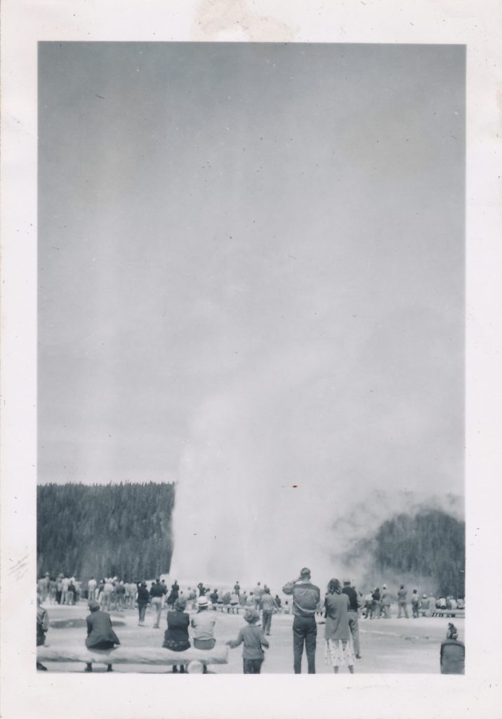 Crowd gathers around Old Faithful in Yellowstone national park 1949.