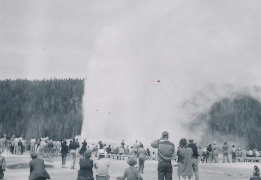 Crowd gathers around Old Faithful in Yellowstone national park 1949.